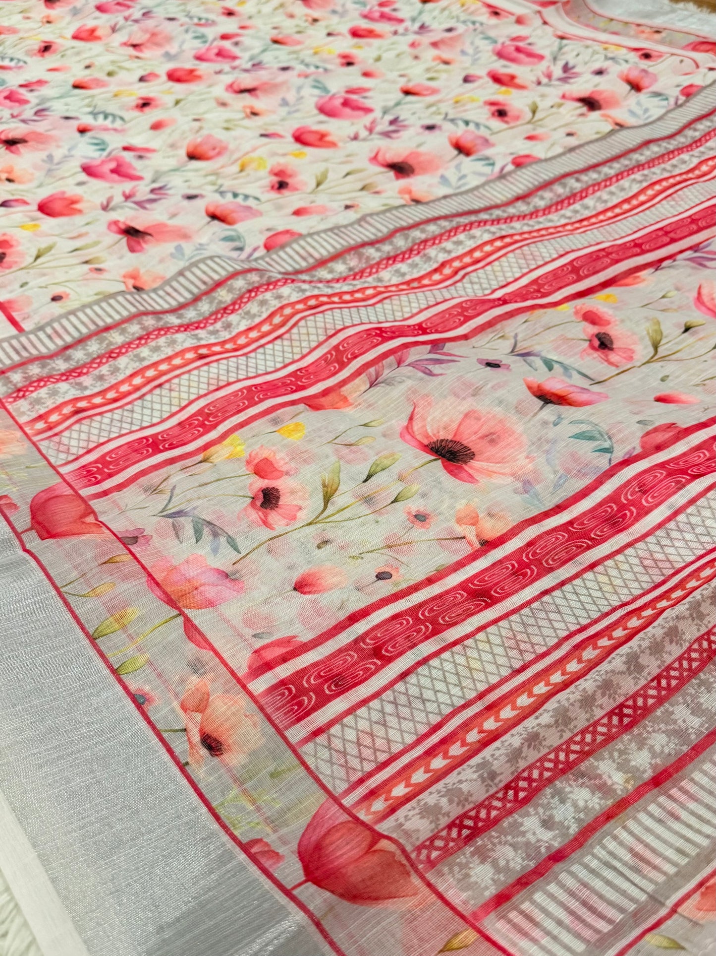 Floral and striped fabric pattern on a flat surface