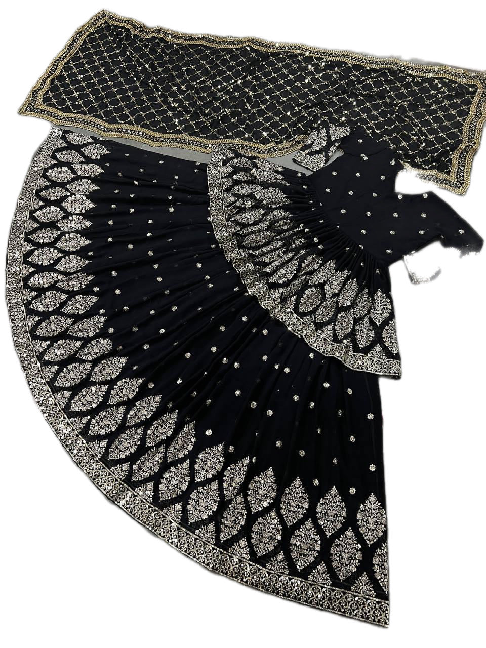 Black and silver patterned fabric with a decorative edge on a white background