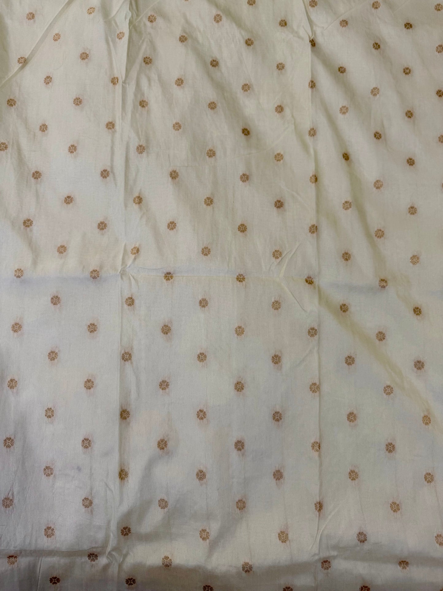White fabric with small brown dots
