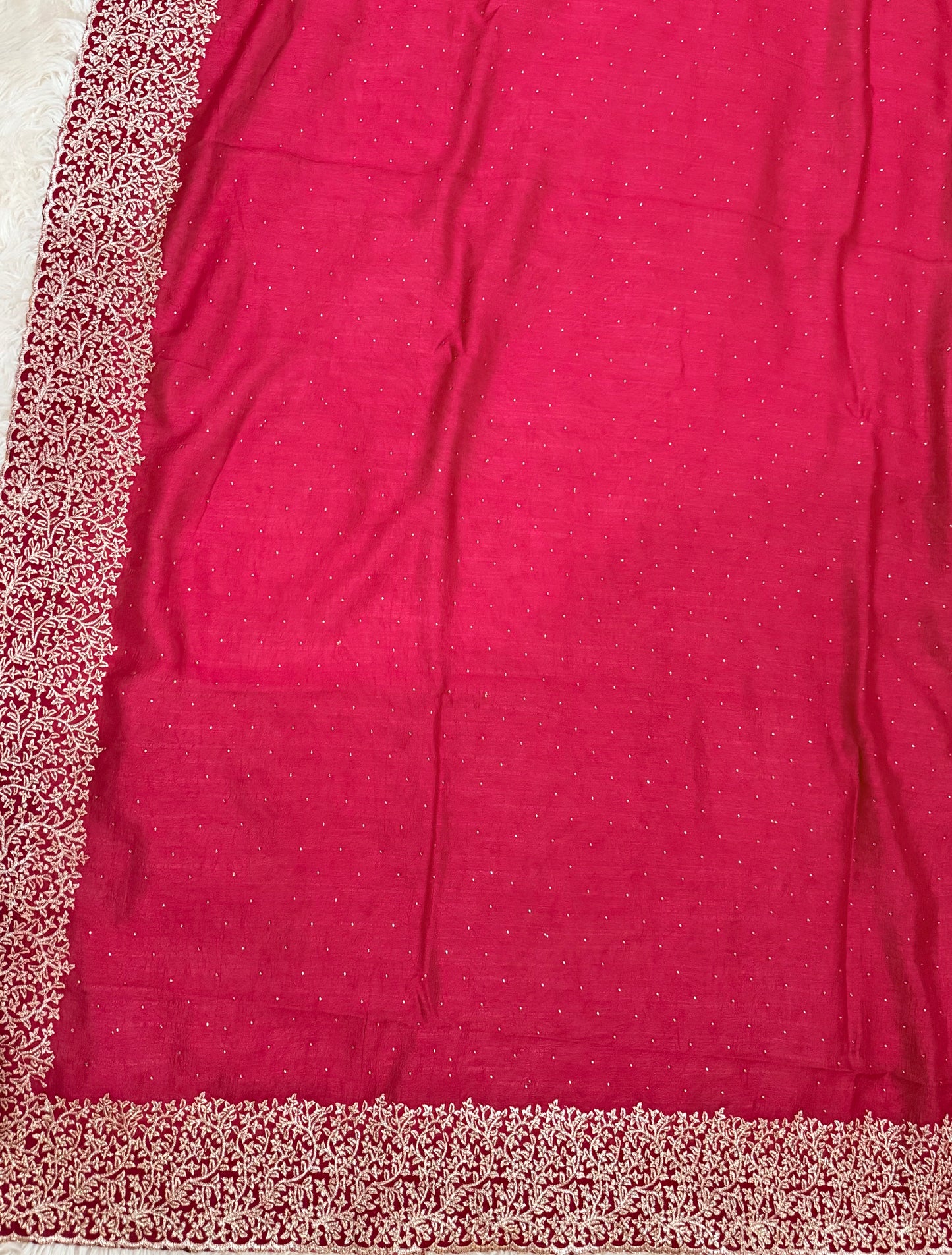 Red fabric with a subtle pattern on a plain background