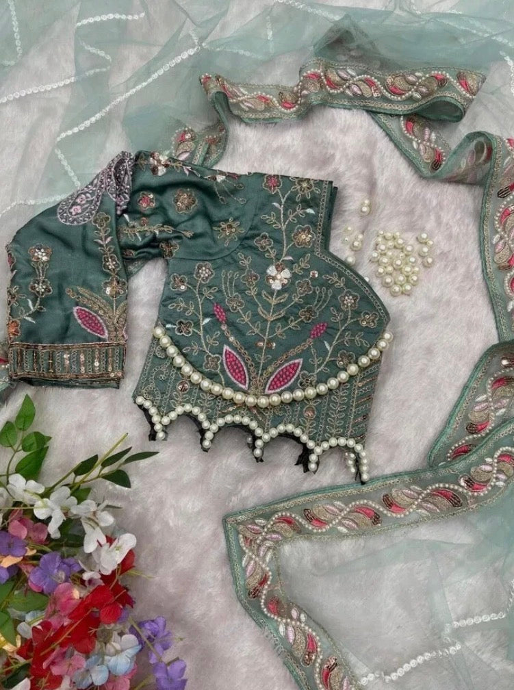 Latest Bollywood Style Pastel Green Embroidered Blouse with Pearl Detailing and Premium
Net Saree