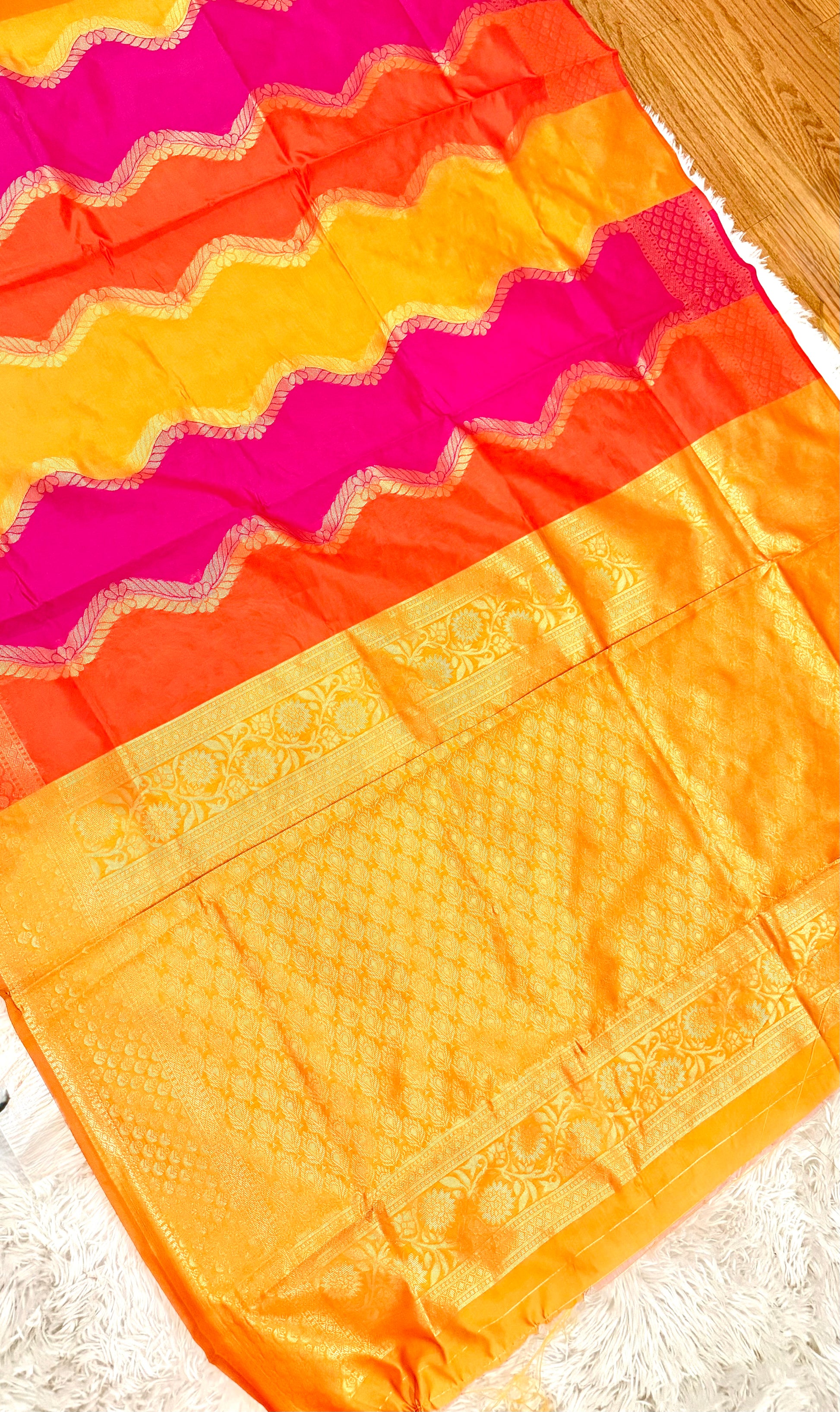 Colorful fabric with zigzag pattern on a wooden surface