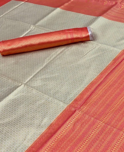 Close-up of a folded fabric with a geometric pattern on a textured surface.