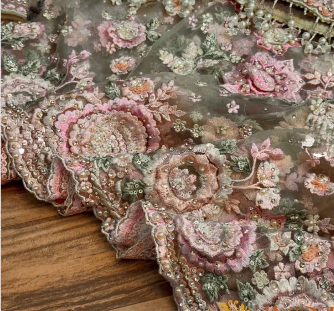 Embroidered fabric with floral patterns on a wooden surface