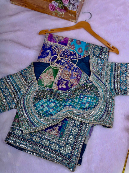 Decorative embroidered fabric on a white surface with a hanger.