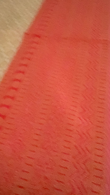 Close-up of textured coral fabric