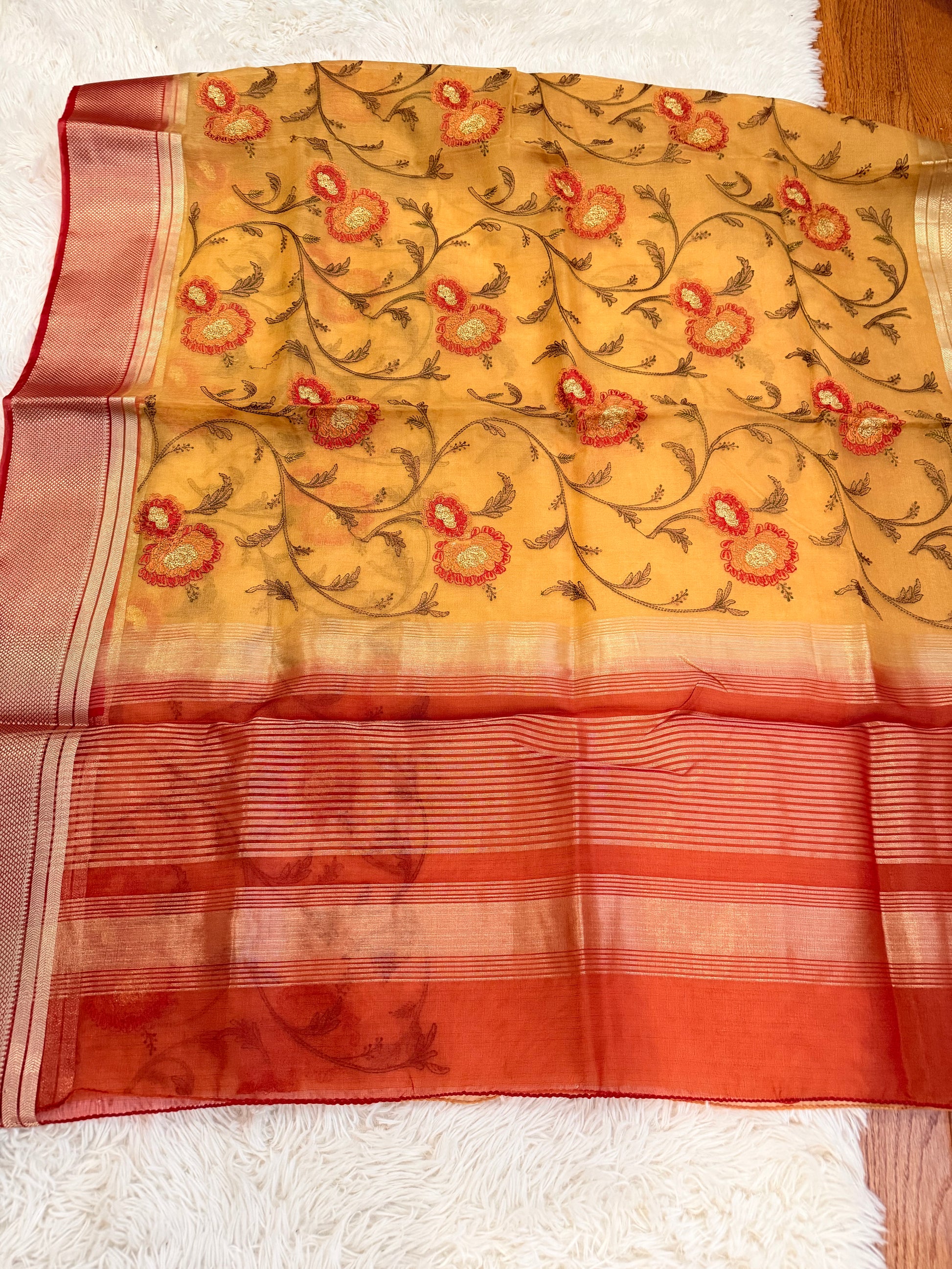 Saree with floral pattern on a white background
