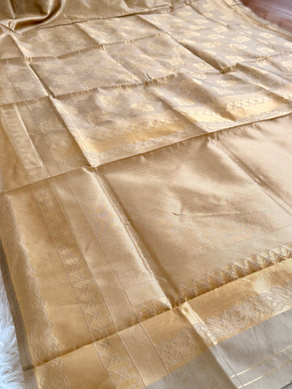 Beige fabric with gold embroidery on a white background