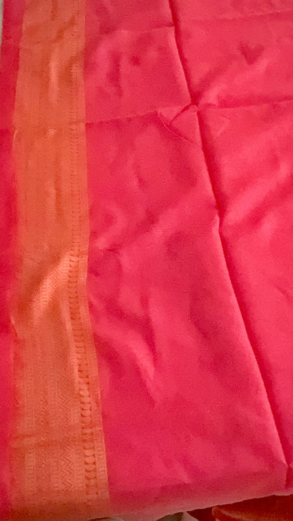 Close-up of a pink fabric with a subtle pattern