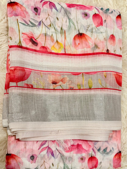 Floral patterned fabric with red and pink flowers on a white background