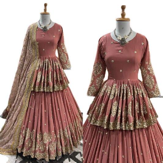 Pink traditional outfit with gold embroidery on a white background