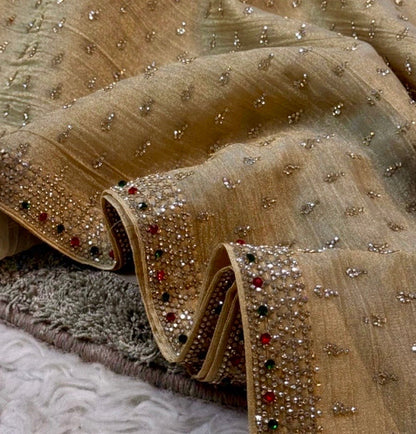 Decorative fabric with embellishments on a textured surface