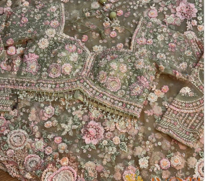 Embroidered fabric with floral patterns and intricate designs