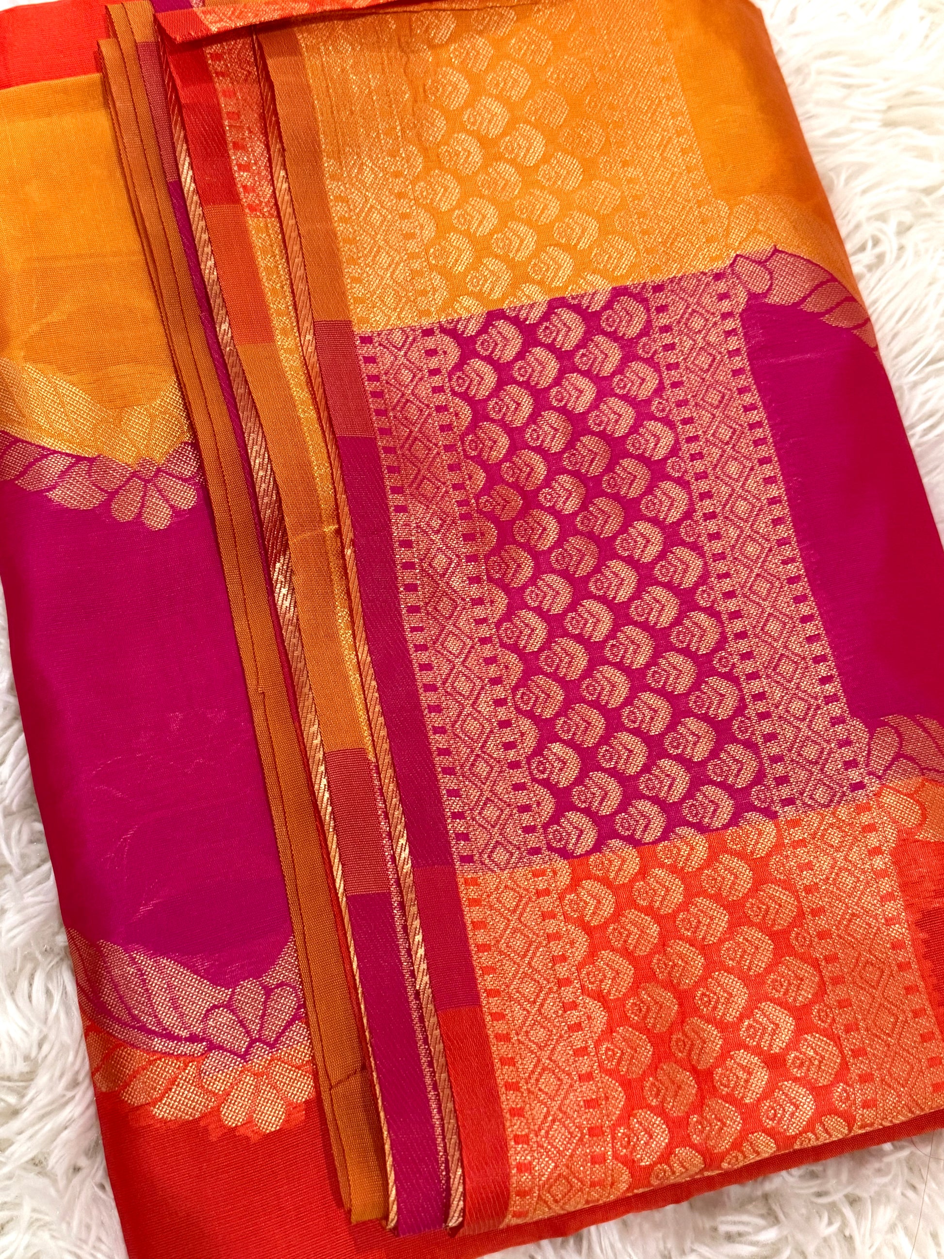 Colorful saree with intricate patterns on a white background