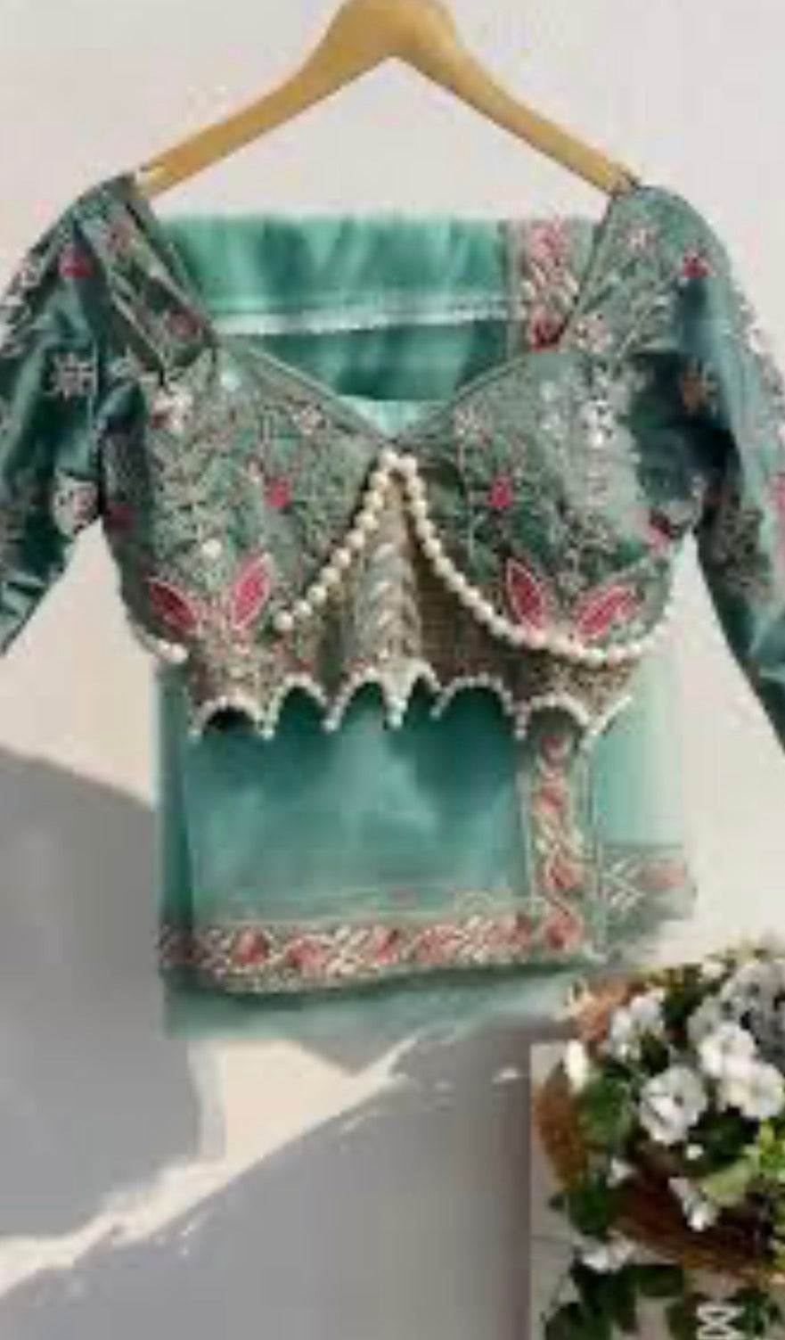 Latest Bollywood Style Pastel Green Embroidered Blouse with Pearl Detailing and Premium
Net Saree