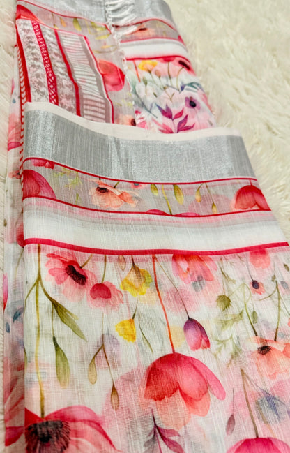 Floral patterned fabric with red and pink flowers on a white background