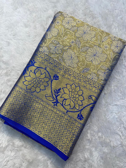 Decorative fabric with blue and gold patterns on a textured surface