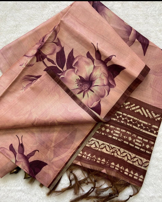 Folded brown scarf with floral and geometric patterns on a light background