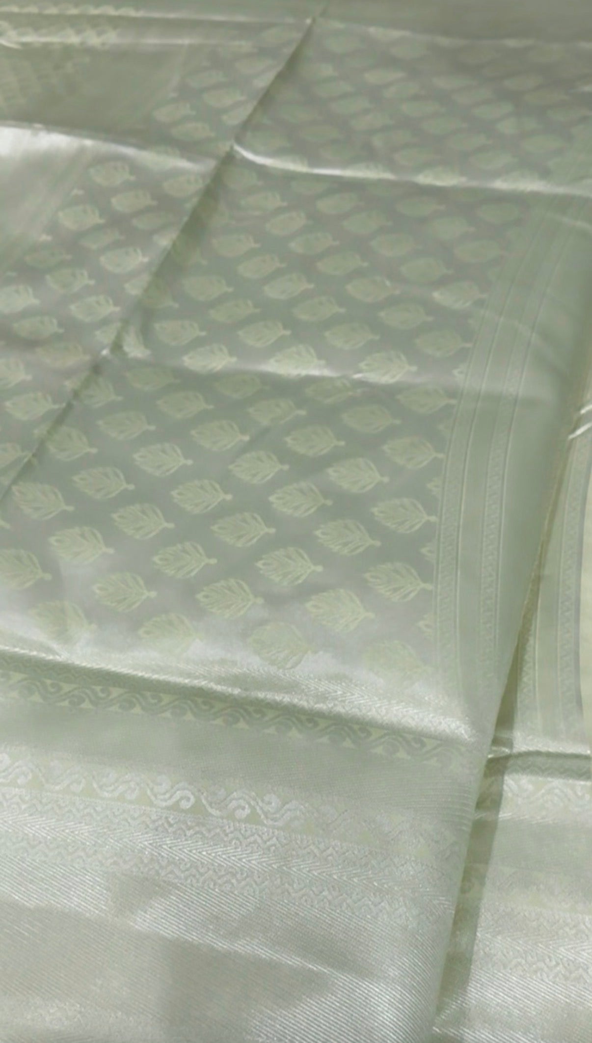 Light green fabric with a subtle pattern