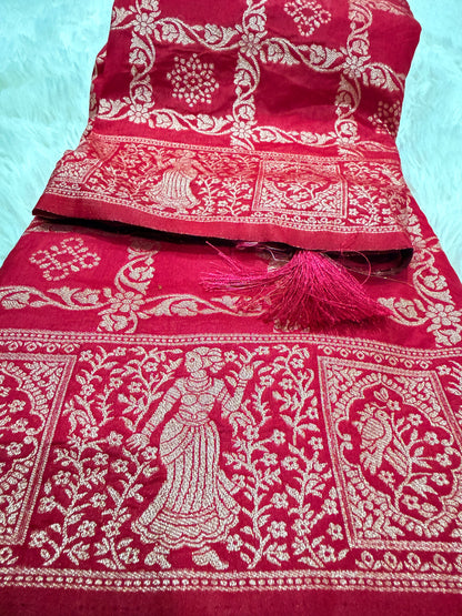 Red fabric with white intricate patterns on a light blue background