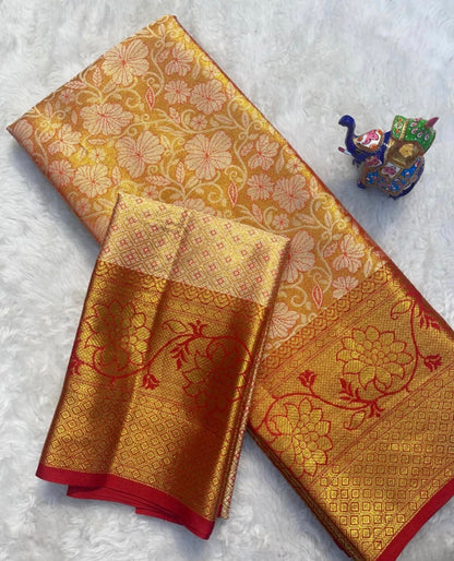Gold and red patterned fabric on a white background