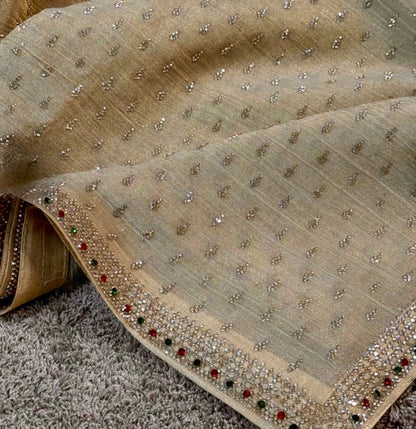 Decorative fabric with bead embellishments on a textured surface