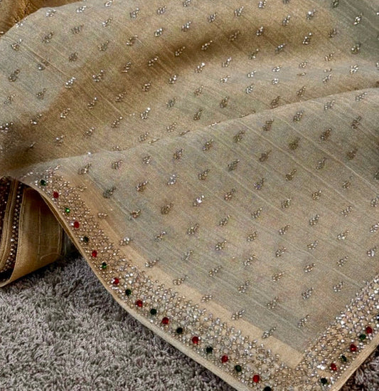 Decorative fabric with bead embellishments on a textured surface