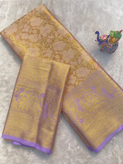 Gold and purple fabric with intricate patterns on a light gray background
