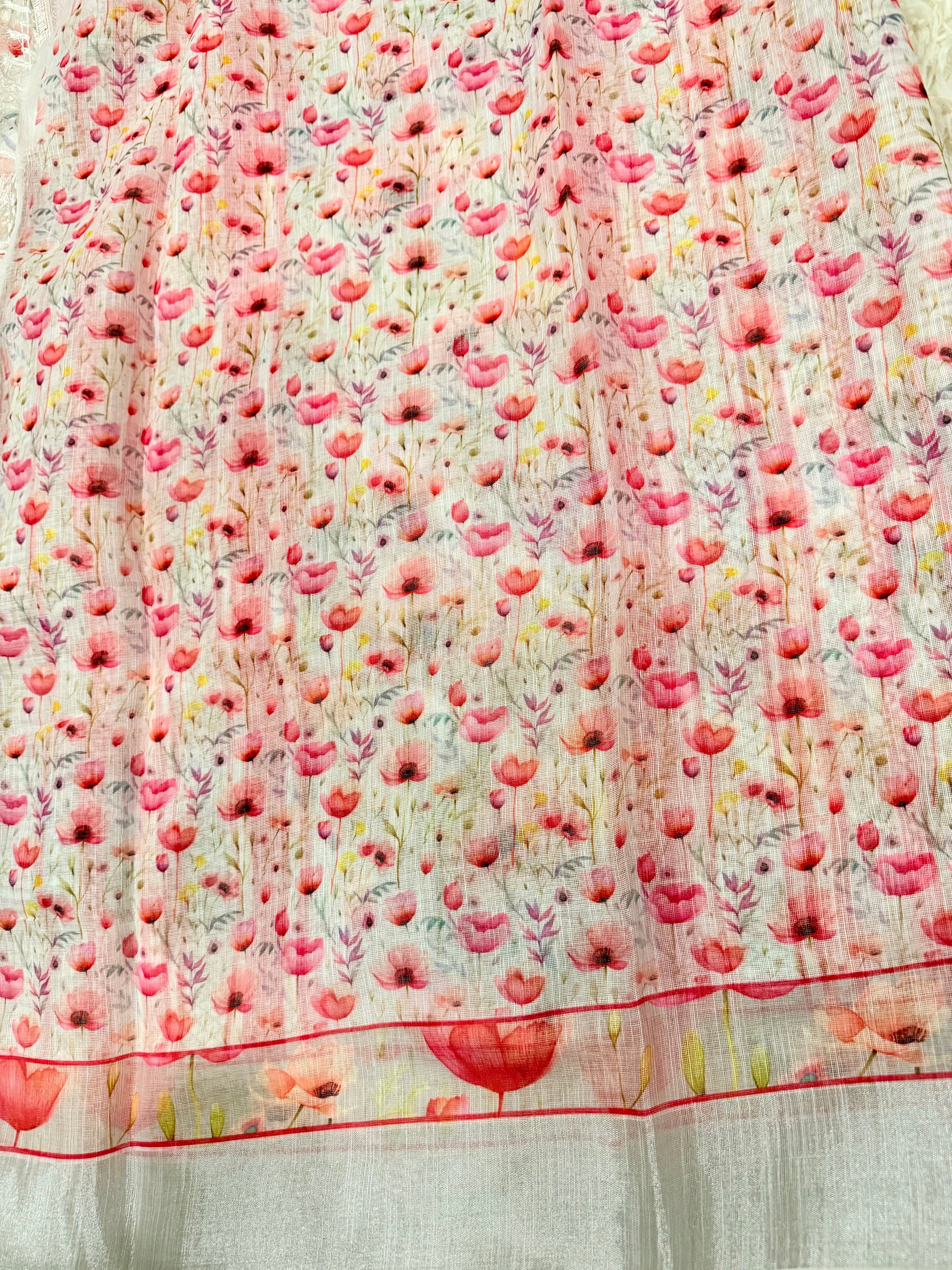 Floral patterned fabric with pink flowers on a white background