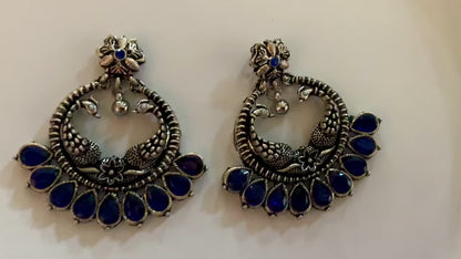 A video of ornate earrings pair